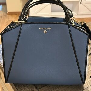 Michael Kors purse only used a few stones has been in the closet for a year